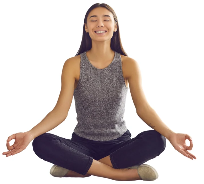 Girl sitting in yoga position representing peacy of mind
